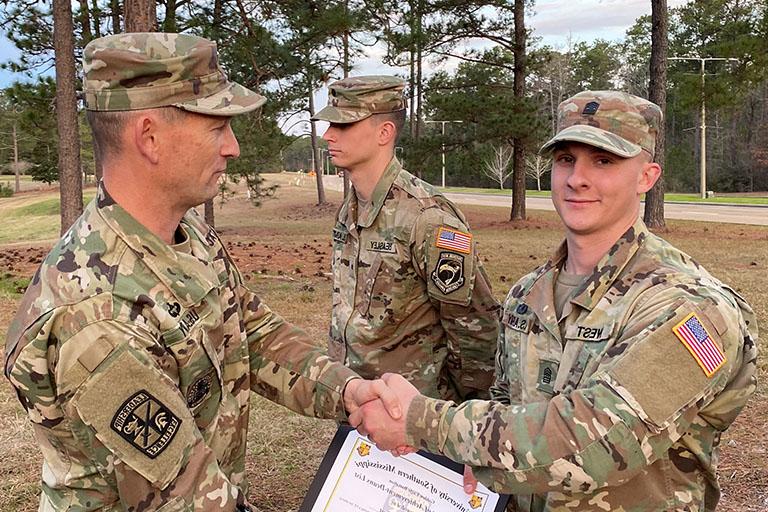 Photo of Army ROTC Cadet being honored